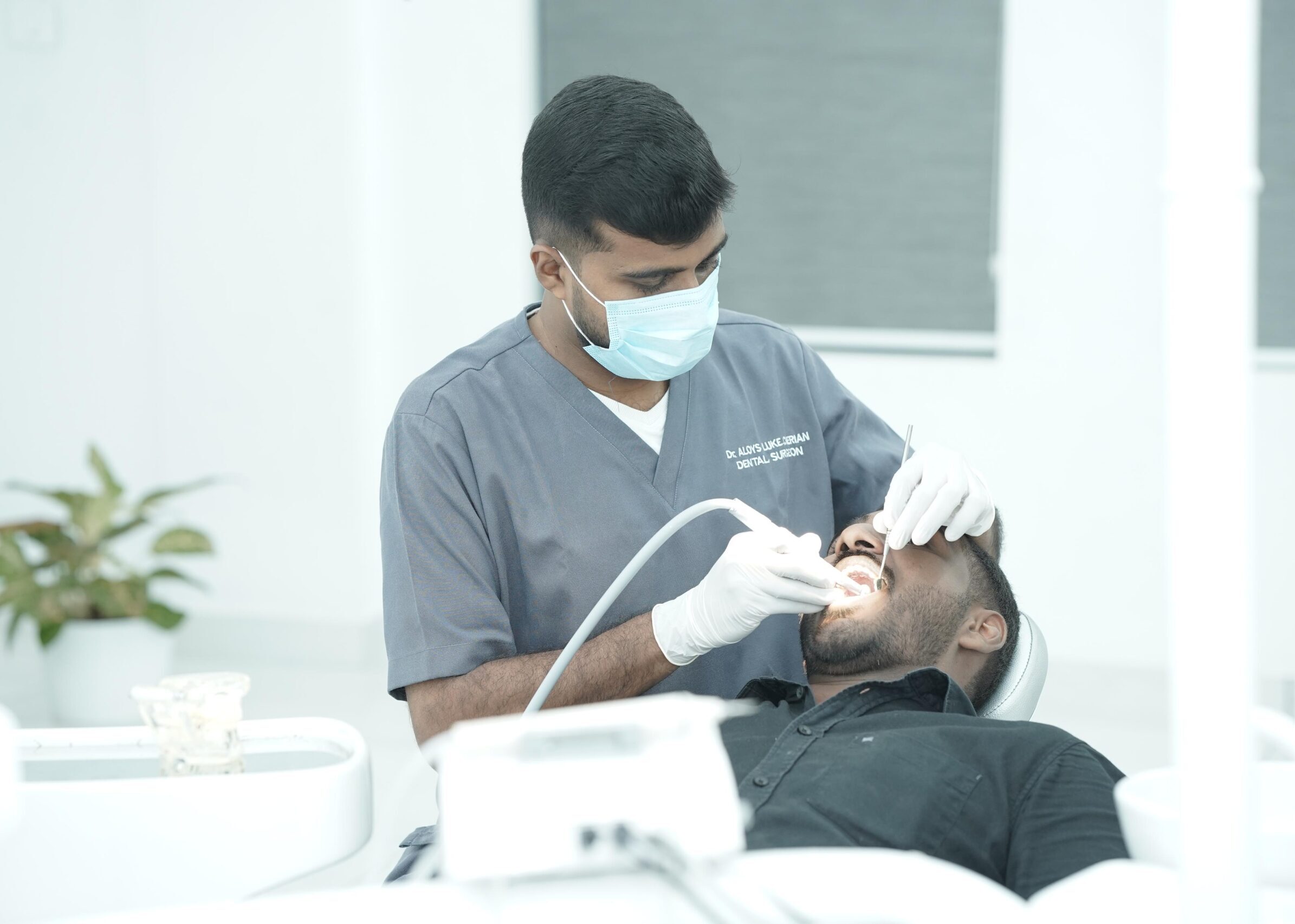 Image of a patient getting treated in a dental clinic by a dental professional